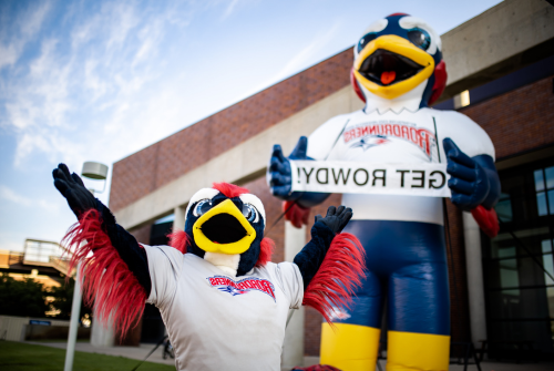 Rowdy mascot in front of Rowdy inflatable